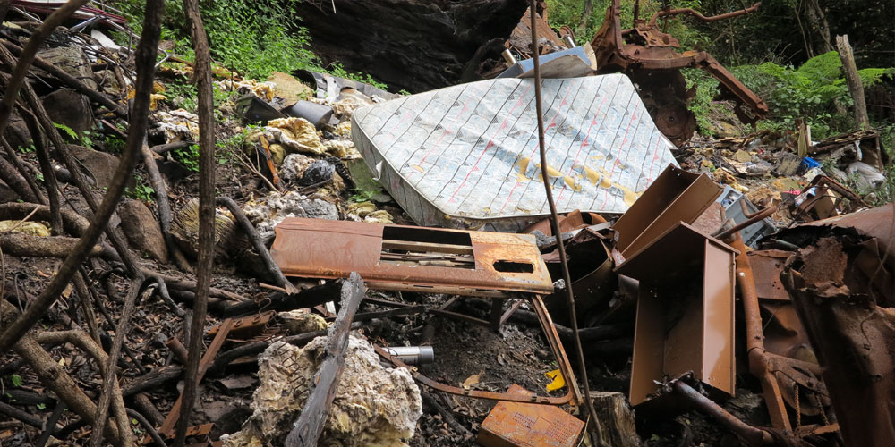Brogan Bunt, A Line Made By Walking and Assembling Bits and Pieces of the Bodywork of Illegally Dumped Cars Found at the Edge of Roads and Tracks in the Illawarra Escarpment, 2013. llawarra escarpment, Sydney, Australia. Image courtesy of the artist.
